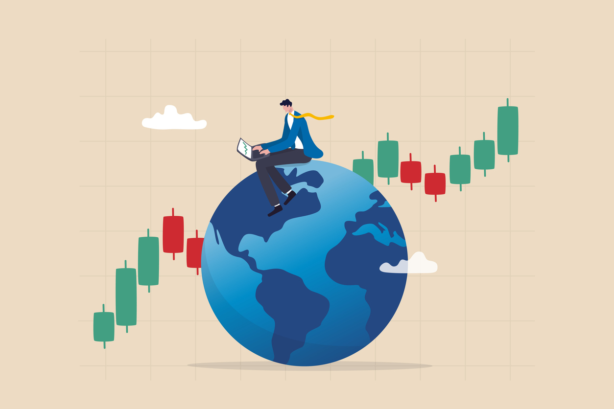 Global stock market, world or international investment, financial analysis or earning growth, stock trading concept, smart businessman investor trading on laptop on the globe with financial graph.